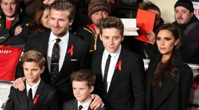 David Beckham with Victoria beckham and kids wearing black and white suits