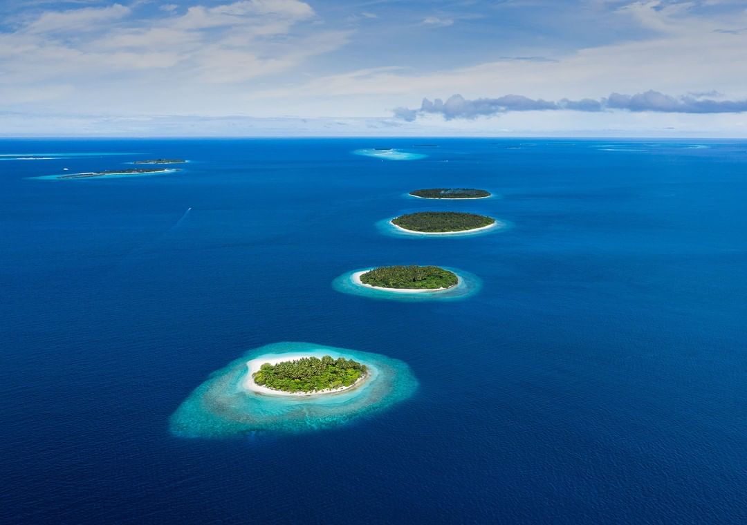 islands of maldives , a chain of islands aligned in a row