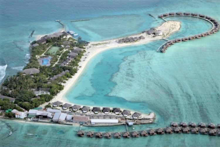 Cinnamon Dhonveli Maldives aerial view from a drone. Over waters villas and restaurants.