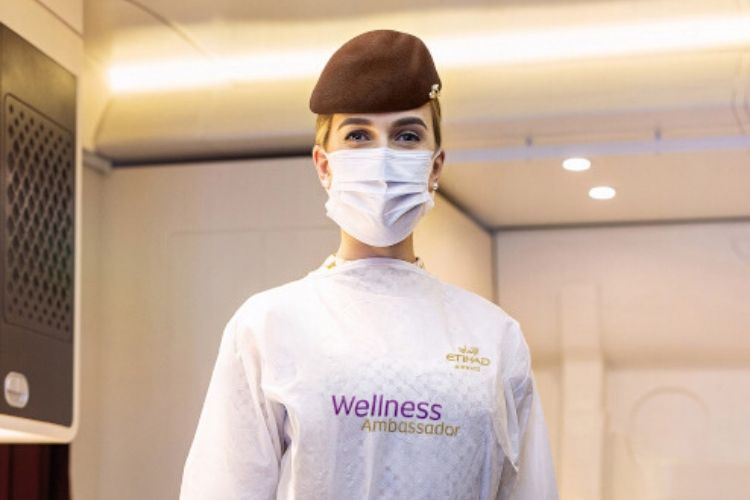 Etihad Airways wellness ambassador dressed in PPE, custom design to the airline