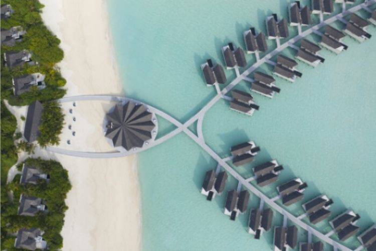 An Ariel view of Movenpick Resort Kuredhivaru Maldives water villas. Situated over the beautiful turquoise lagoon of the island.