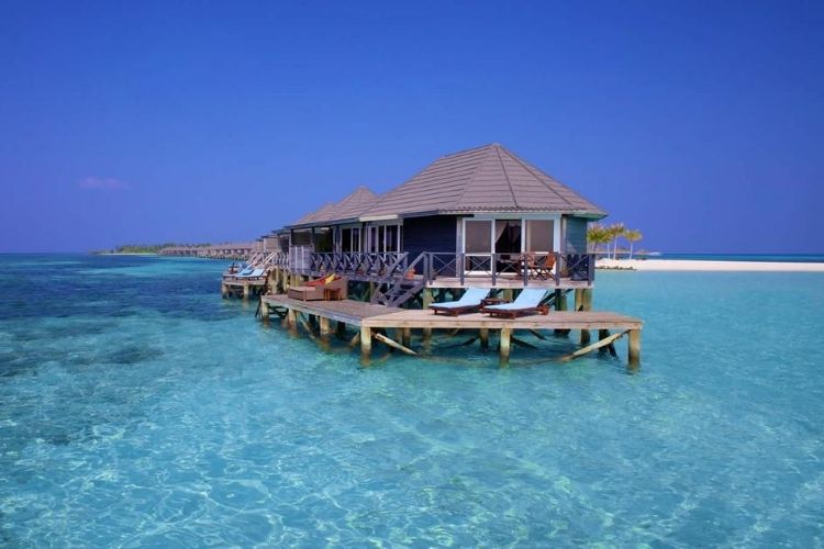 Kuredu Resort Maldives water villas in crystal clear waters.