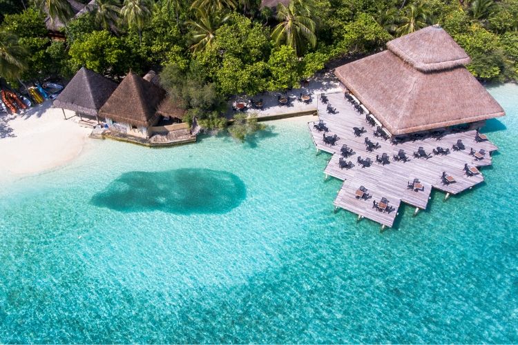 An ariel view of Maldives resort. With the shades of blue in the lagoon and pristine environment.