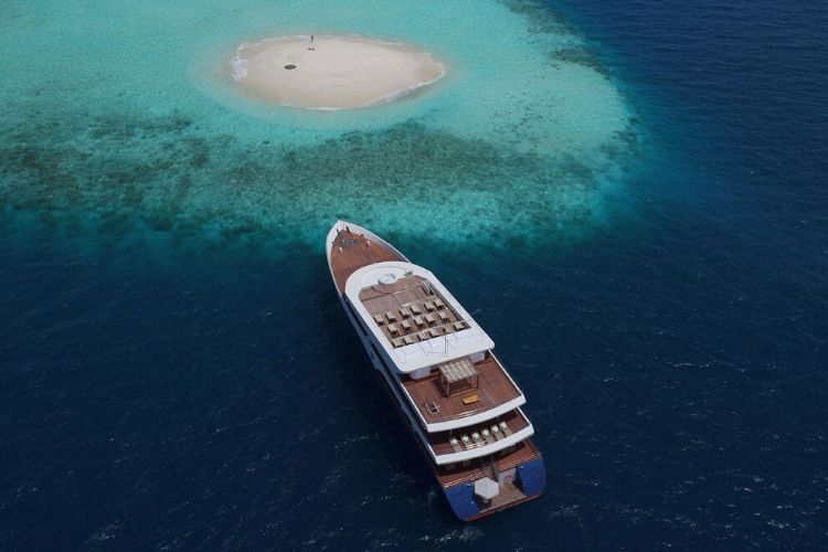 Scuba Spa anchoring near a sandbank in maldives.