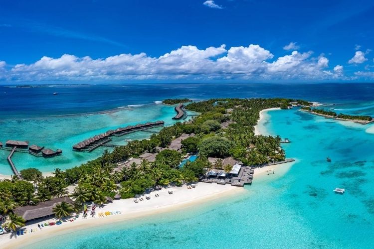 Arial view of Sheraton Maldives with white sandy and turquoise lagoon.