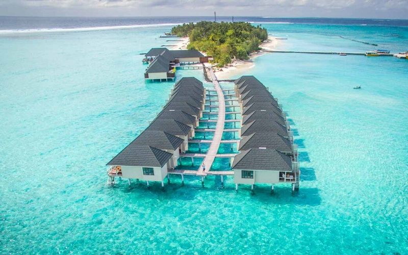 Ariel view of Summer Island Maldives over the water bungalows.