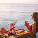 Enjoying a floating breakfast in the pool at Ayada Maldives
