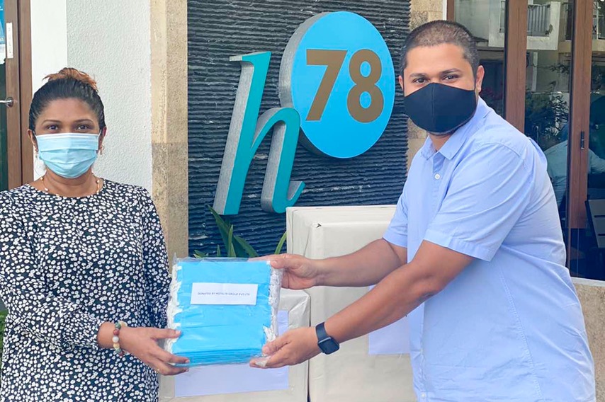 CEO of H78 Handing over masks to president of NBAM