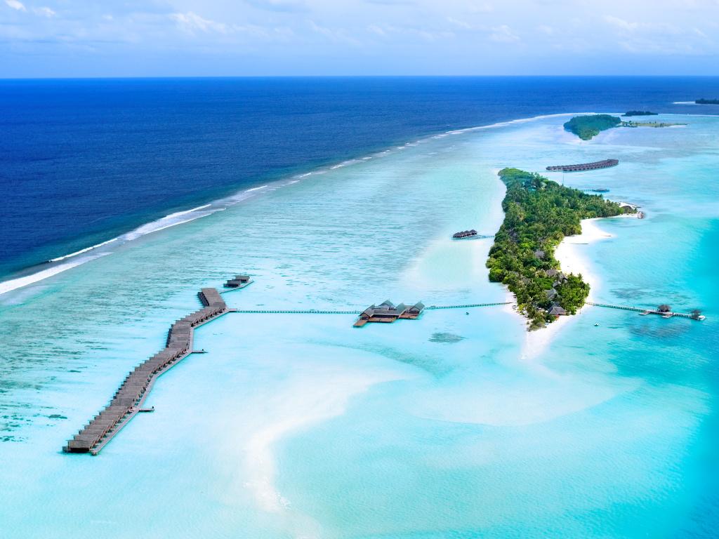 aerial view of Maldives resorts with over-water villas