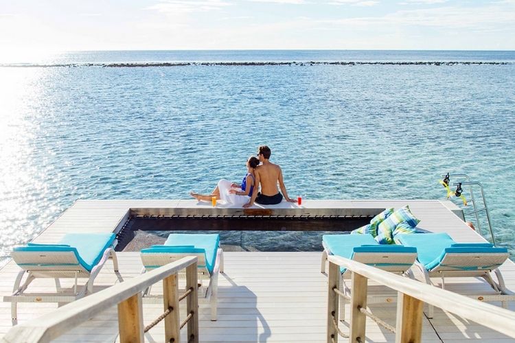 couple enjoying their stay at kandooma Maldives