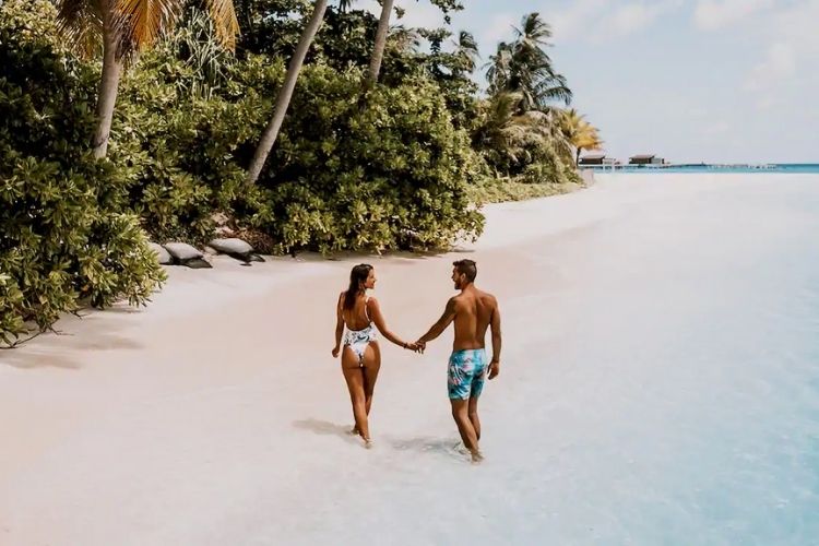 tourist couple on beach in the Maldives