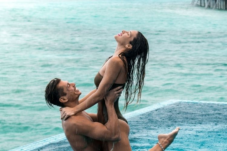 couple enjoying in pool atSheraton Maldives