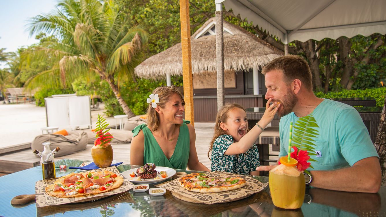 Sheraton Maldives full moon resort and spa: a family enjoying lunch